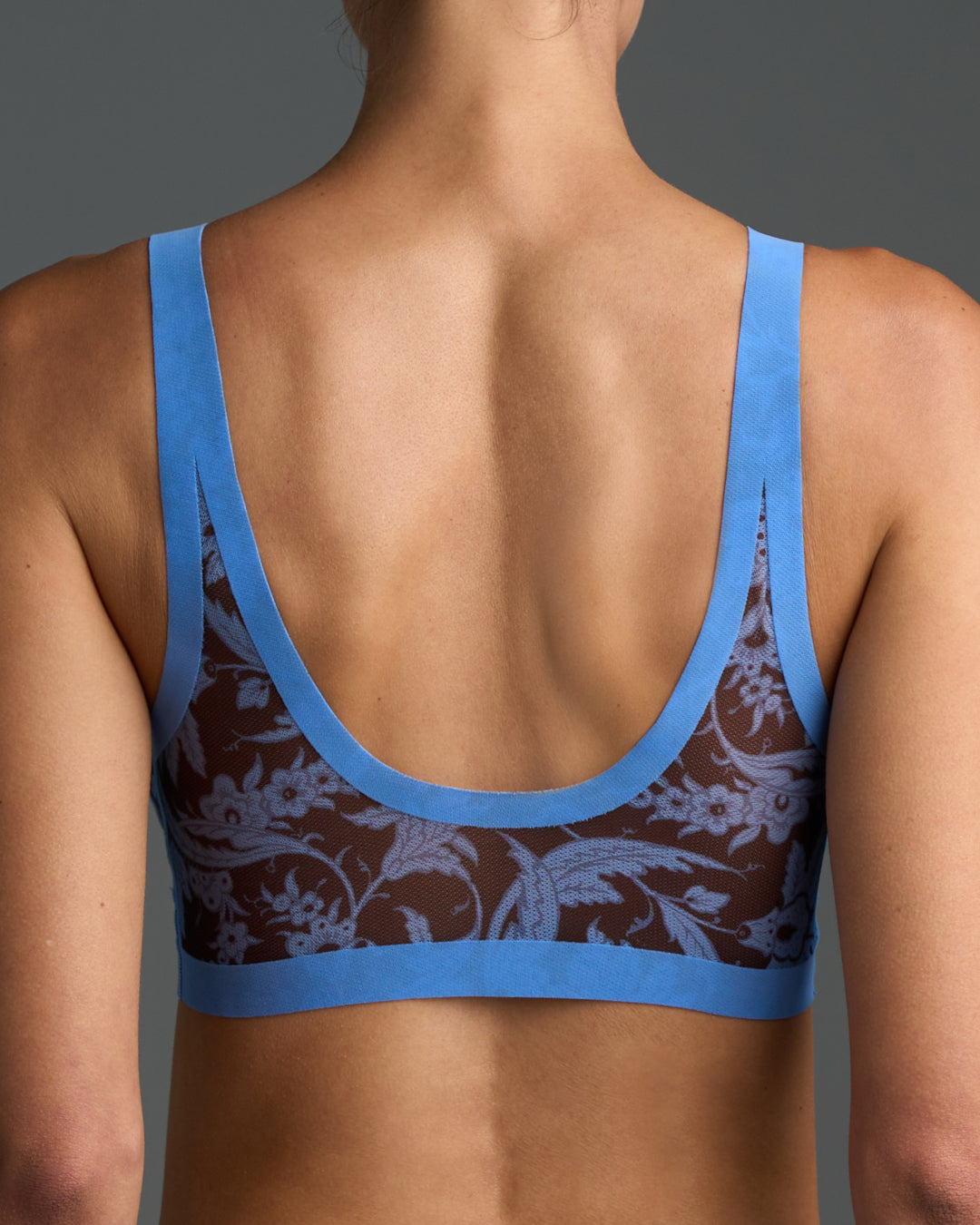 Dune Blue and brown patterned sheer bra on a gray background
