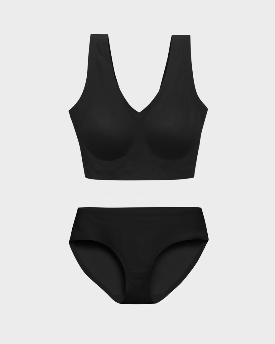 Black wireless bralette and matching bikini panties set in a flat lay.