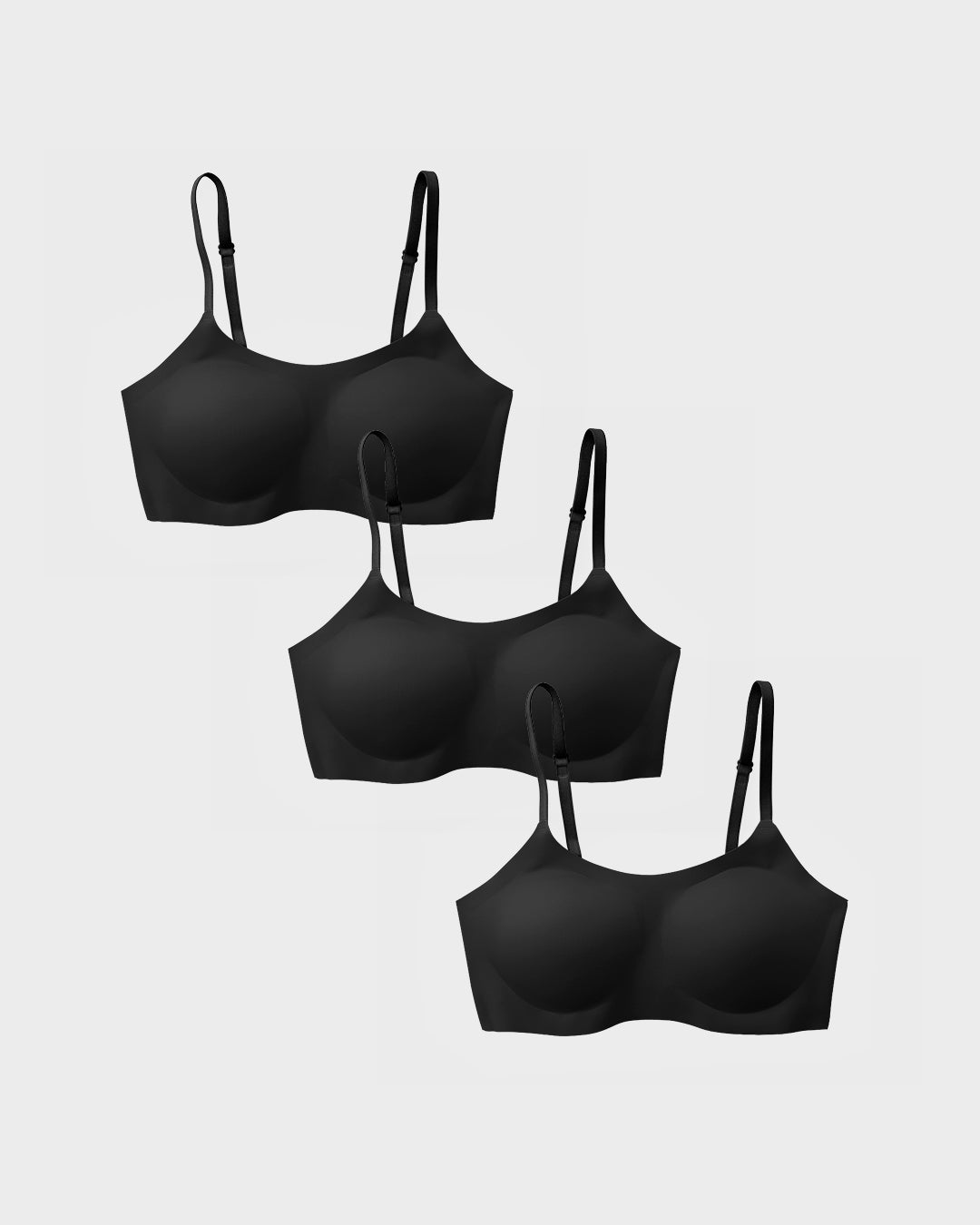 Three black support bralettes in a cascading flat-lay arrangement.