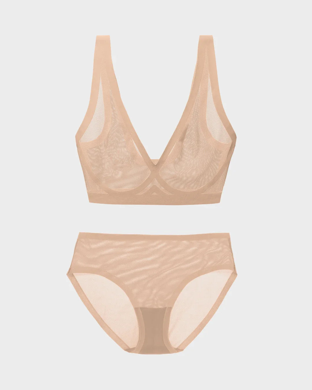 Champagne sheer bralette and matching mesh bikini panties set in a flat lay.