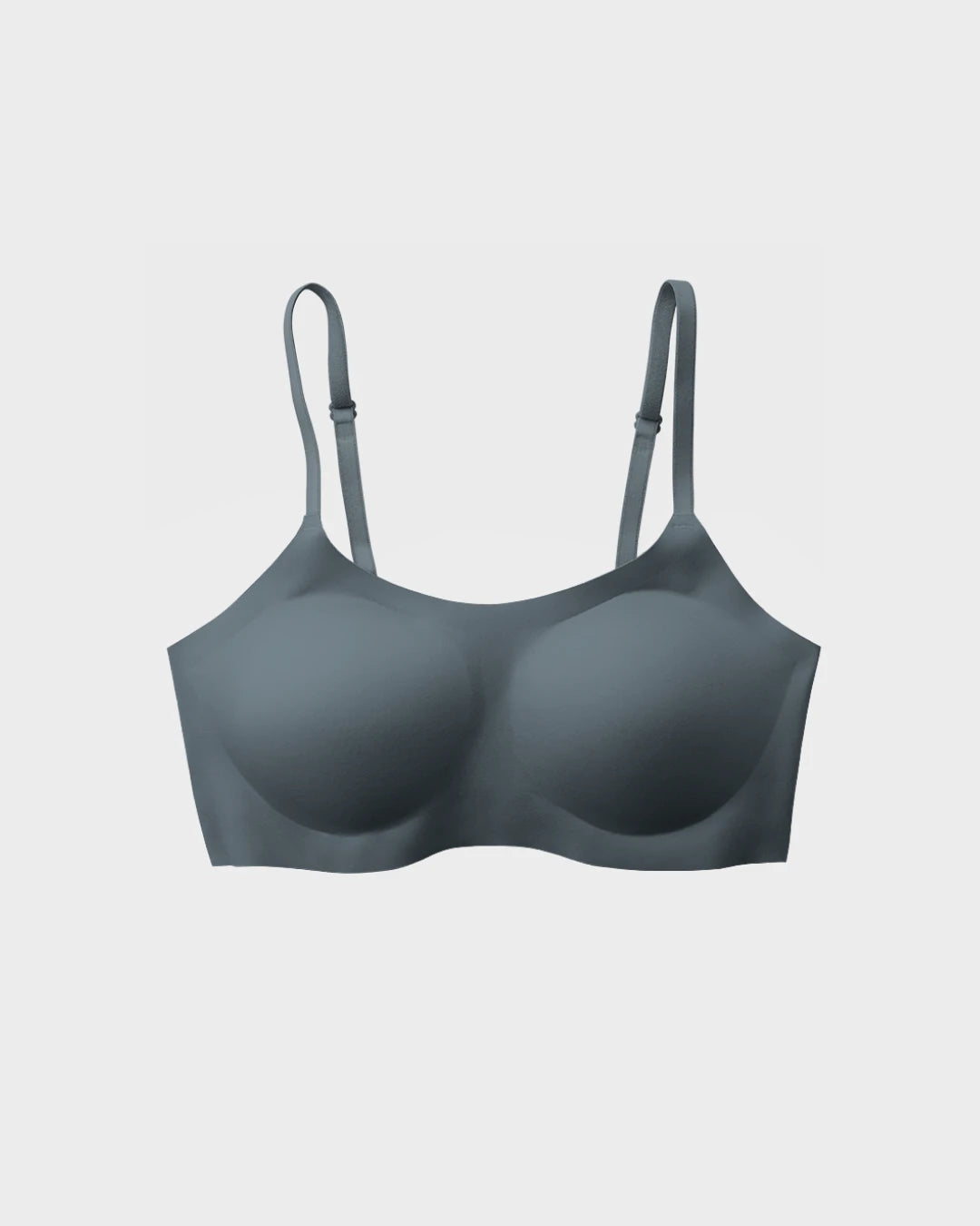 Slate blue seamless scoop-neck bralette with adjustable straps and molded cups laid flat on a white background.