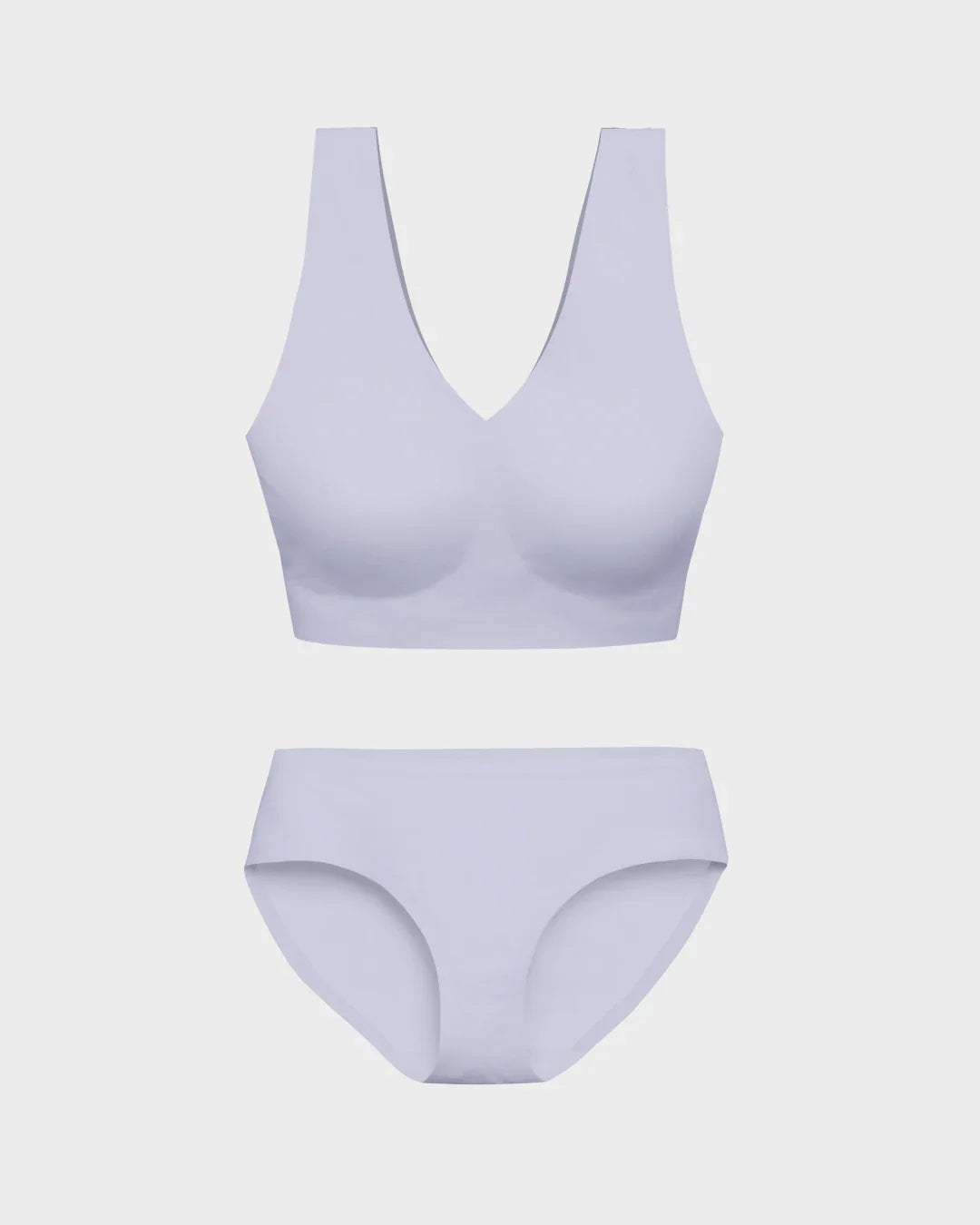 Lavender seamless deep V-neck bralette and matching hipster briefs flat lay on gray background