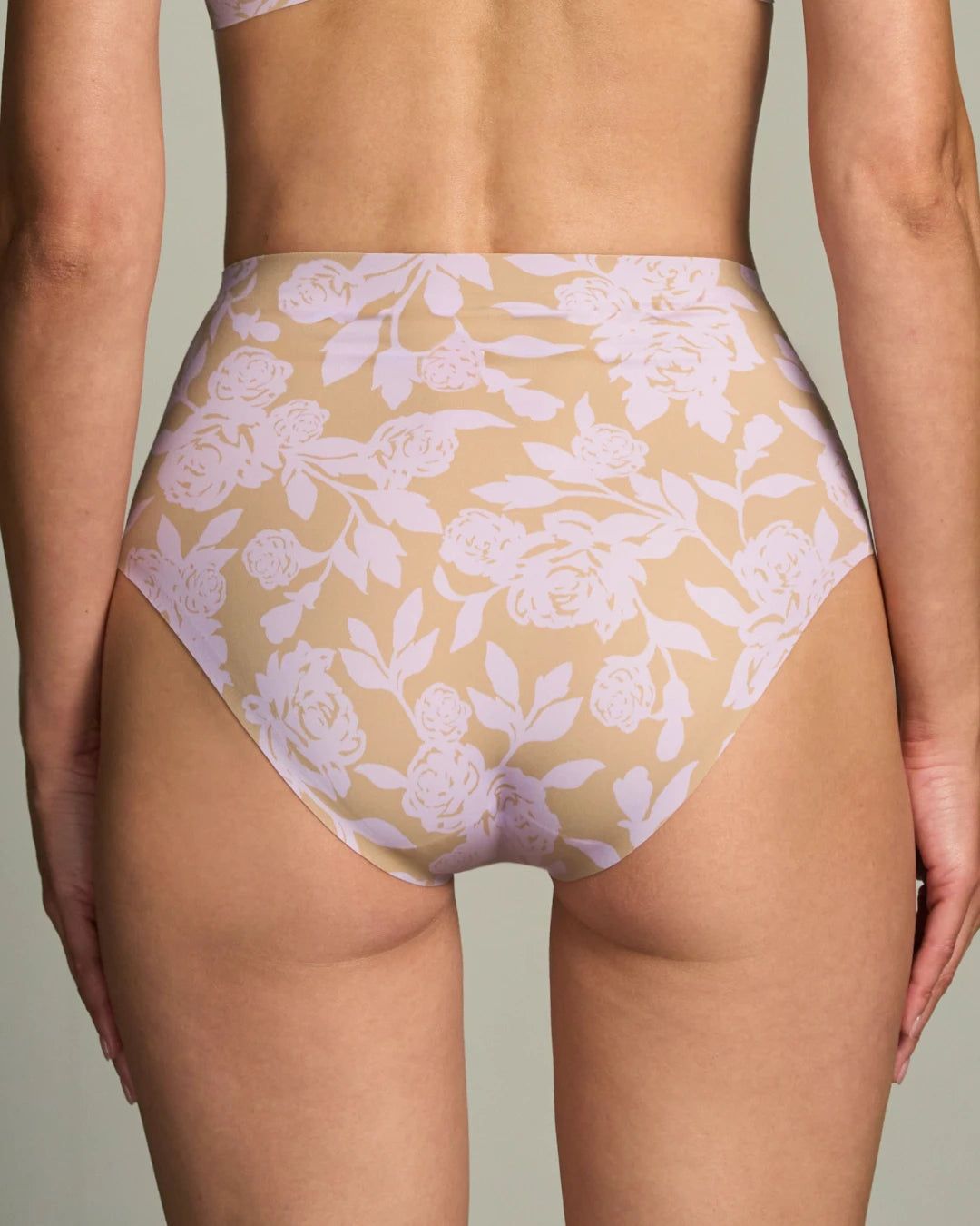 Floral seamless high waisted underwear shown from the back, featuring a beige and lilac print with a smooth, invisible design for a flattering, no show fit