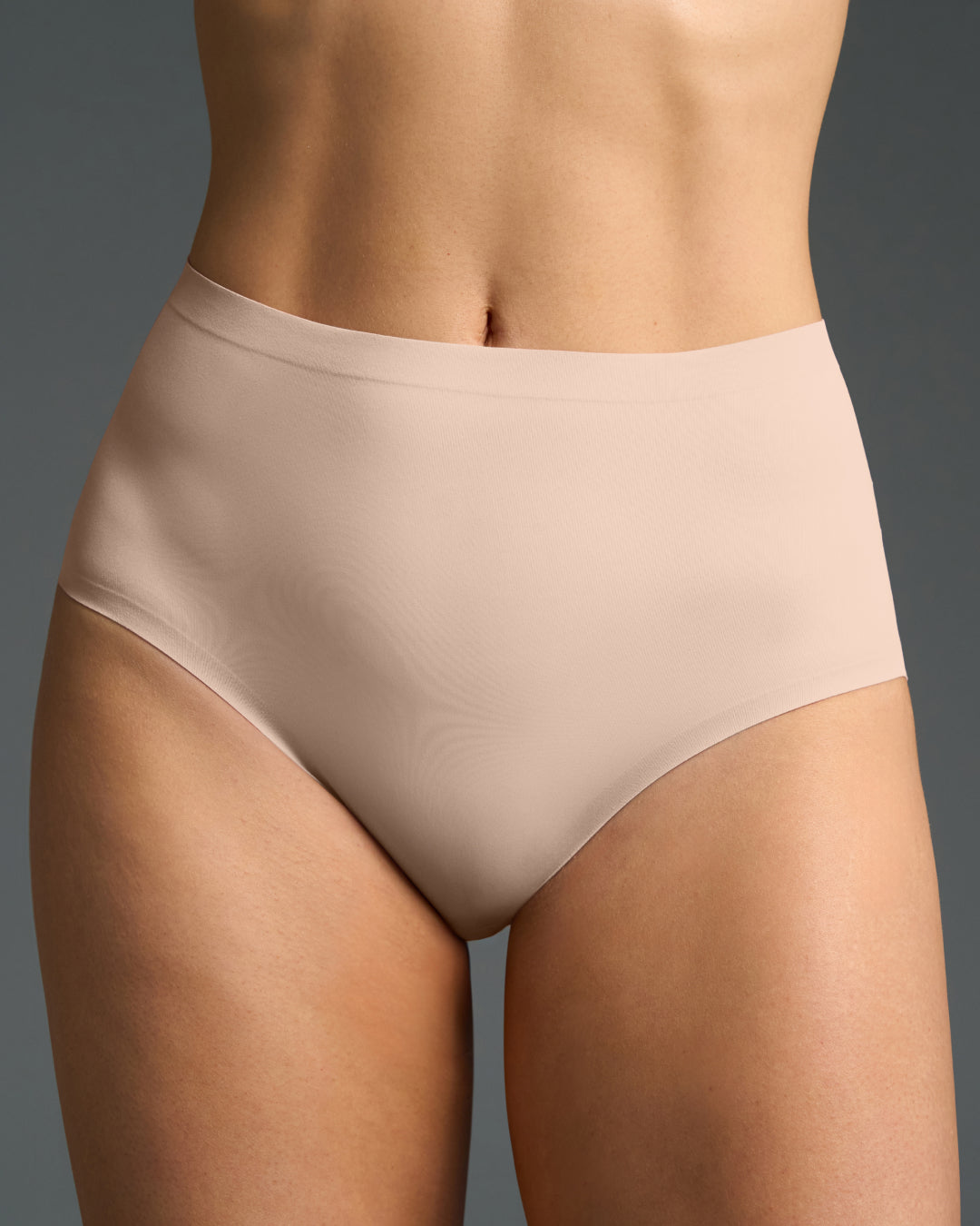 Back view of model wearing seamless high-waisted panties with full coverage.