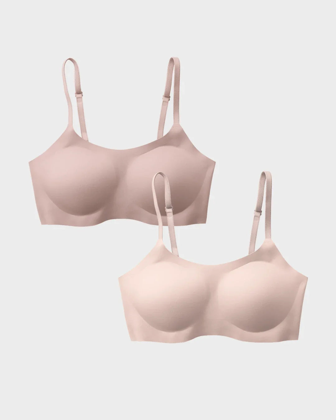 Two seamless wireless support bras in nude and woodrose with molded cups and adjustable straps shown as a bundle set
